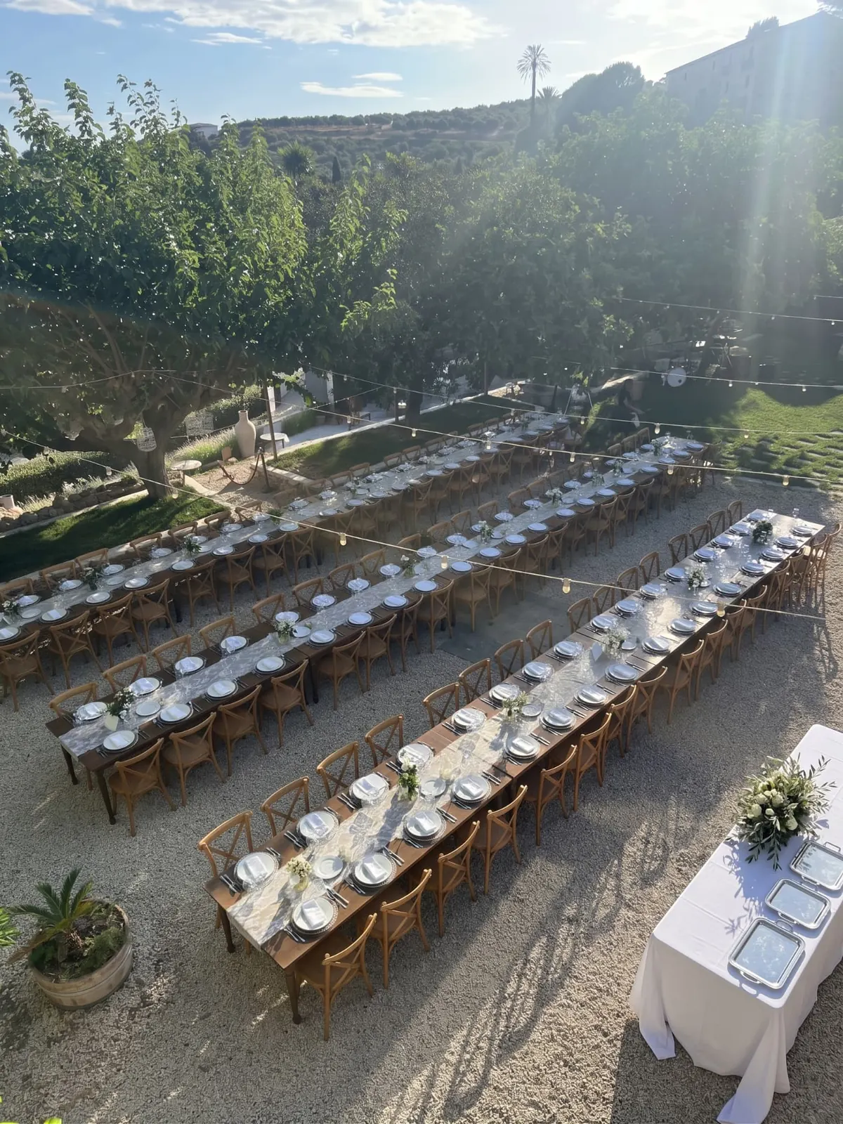 Aerial view of tables set for the wedding reception at the Realmonte masseria