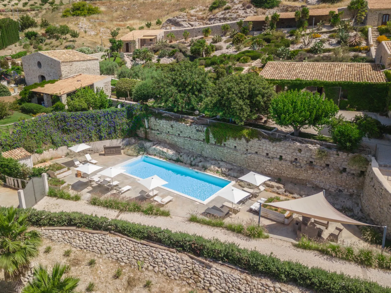 Aerial view of Masseria Agnello with pool, gardens and courtyards for Agrigento weddings