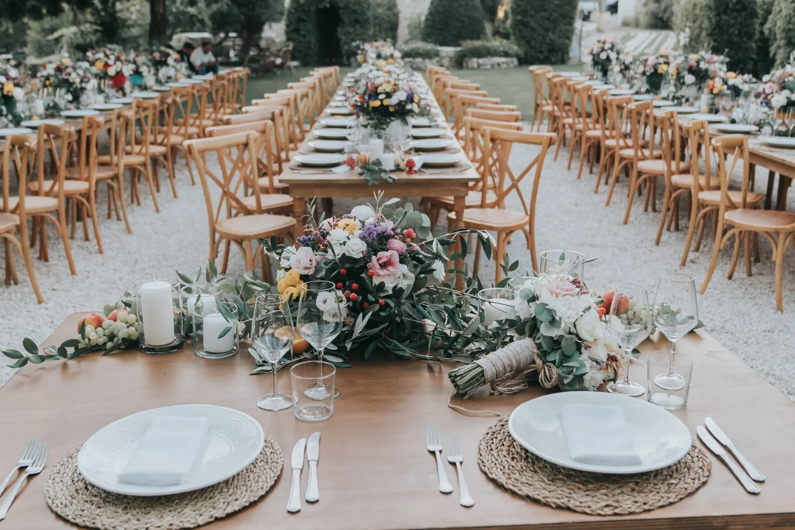Table setting detail with Mediterranean flowers for a masseria wedding in Agrigento